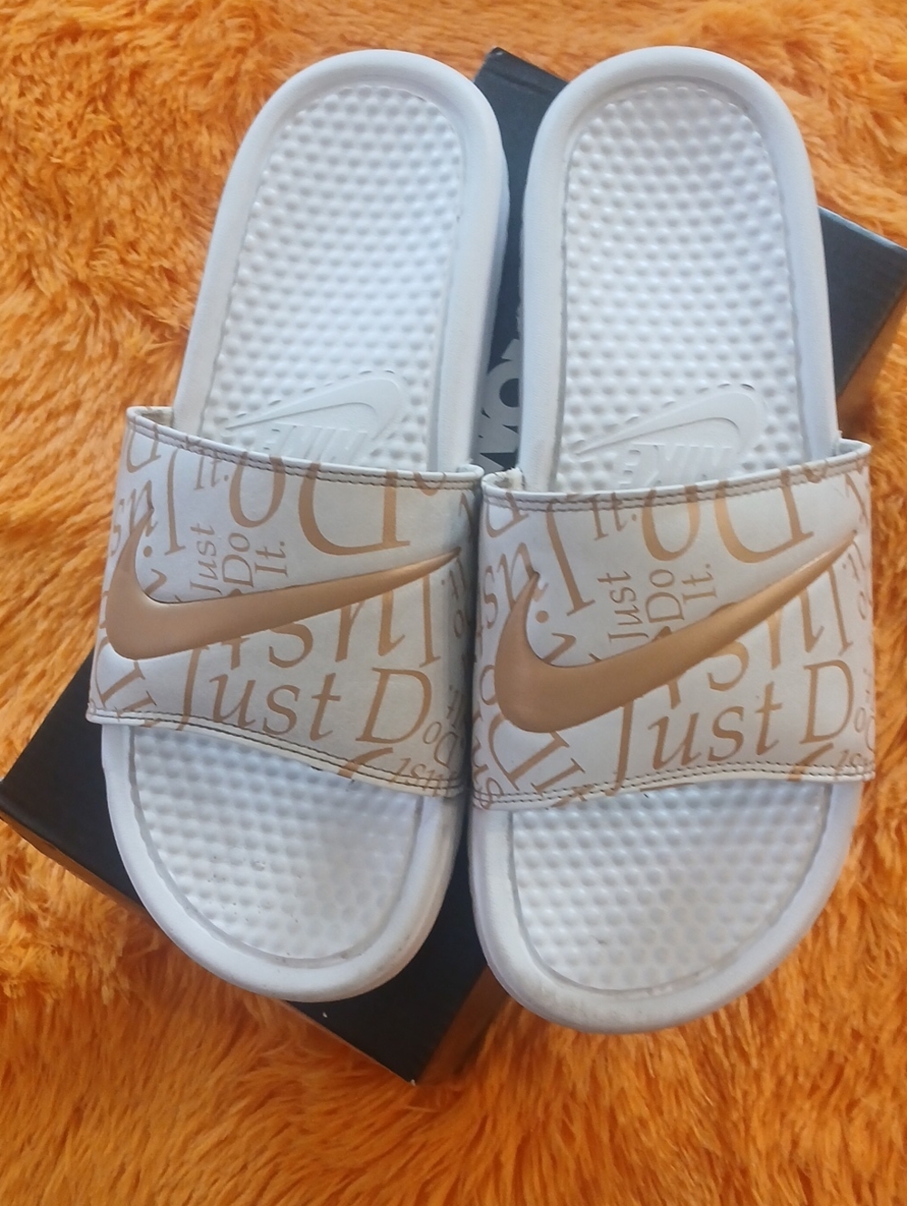 Nike White Slide Sandals with Gold Swoosh and Script